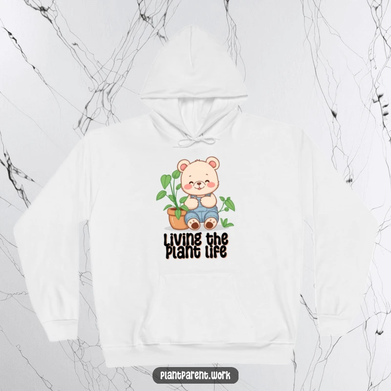 Funny bear cub gardener hoodie, a happy bear cub in overalls cuddling a large potted plant, snug and humorous.