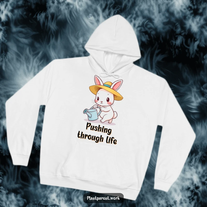Funny bunny gardener hoodie, a determined bunny in a straw hat pushing a watering can, warm and humorous.
